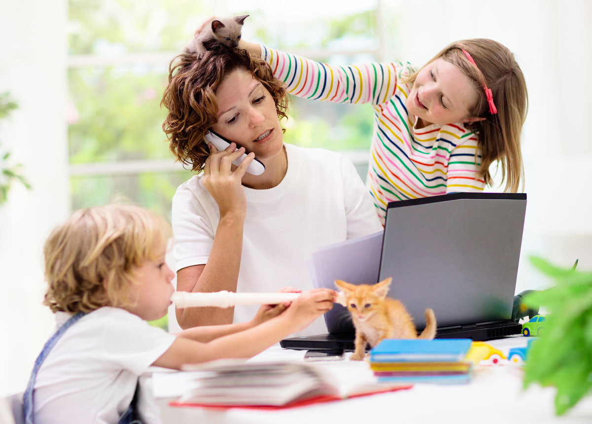 Parent working from home while kids are distance learning