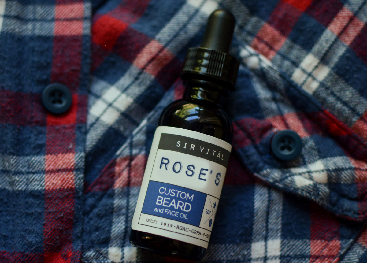 Source Vital's Custom Beard Oil on top of plaid shirt