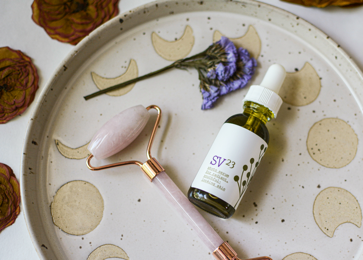 SV23 Phyto Serum on stone plate with rose gua sha roller