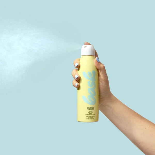 Bask Non-Aeresol Sunscreen Spray SPF 50 in Woman's hand