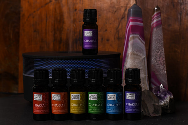 Chakra collection with diffusers and crystals surrounding them