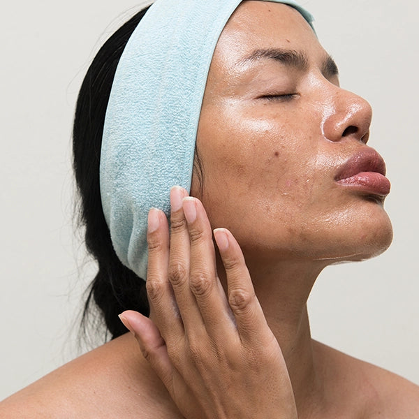 Woman with oily skin wearing headband