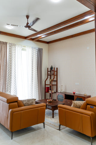 Living room with orange Stanleys sofa, CustHum TV stand, traditional coffee table, open-style shelf, solid wood rafters on ceiling