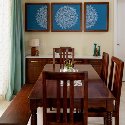Dining room with 6-seater wooden dining set, sideboard and Mandala art work on walls