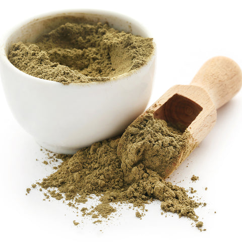 Green powder in a small white bowl