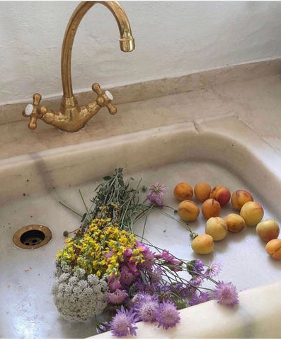 Flowers and fruits in the sink
