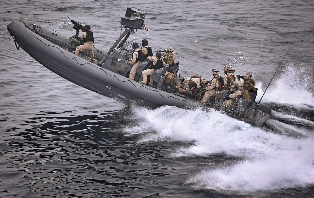 Military boat speeding through the ocean