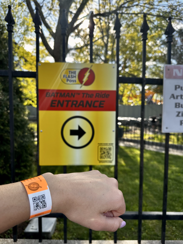 six flags flash pass wristband at entrance of ride