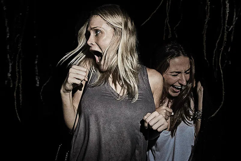 Two women getting scared at Halloween Horror Nights