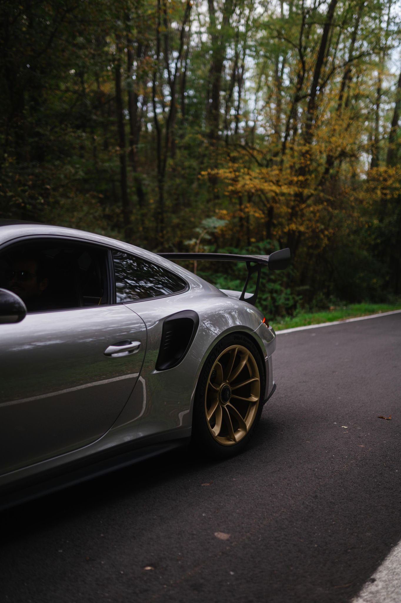 Side view of Porsche GT3RS in fall, photo by Sajin Park in Milan, Italy.