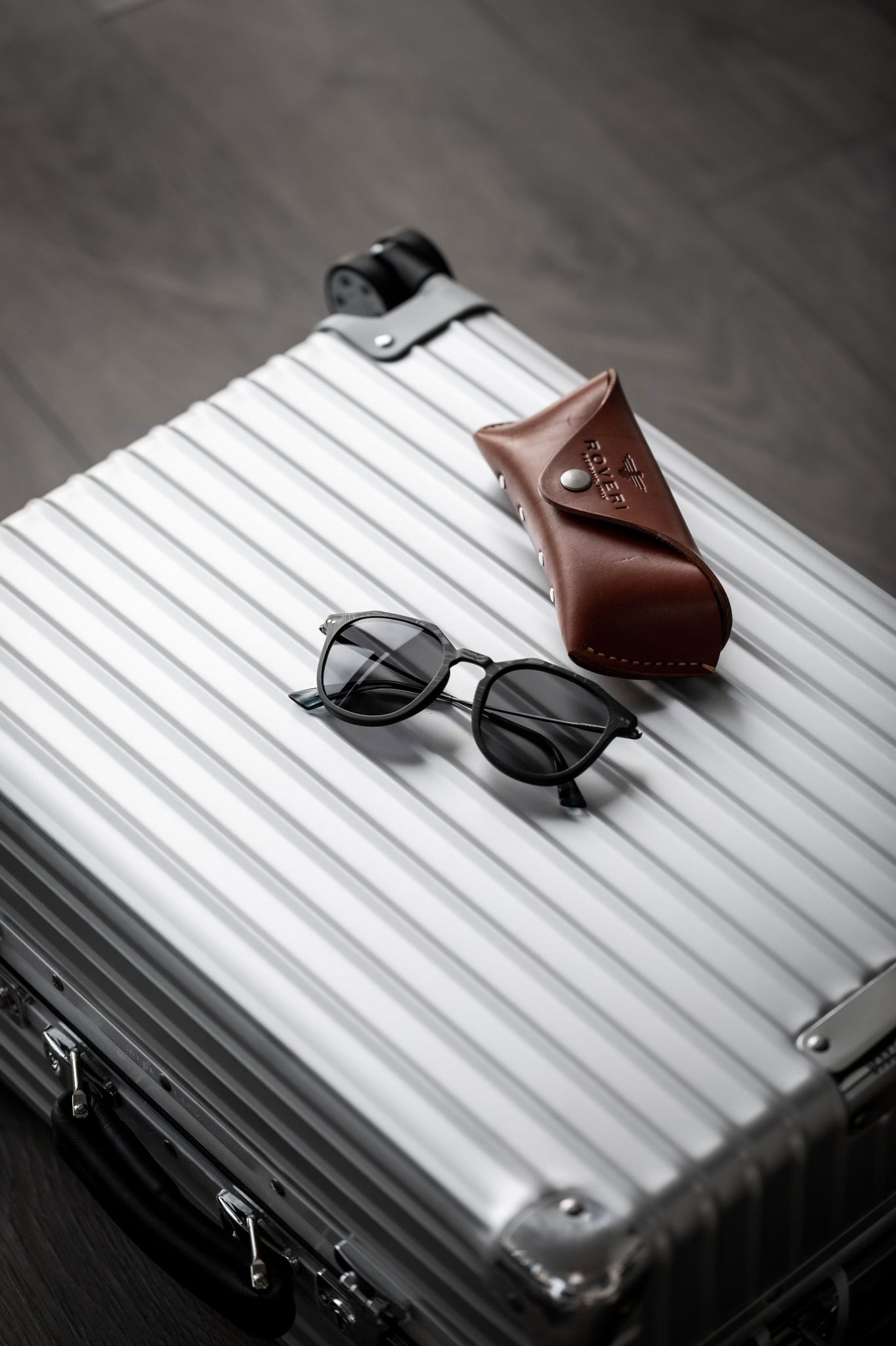 Roveri Eyewear clm7 black on black x Rimowa classic cabin suitcase paired with premium handmade leather case.