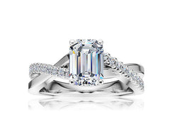 Emerald Shape Center Diamond Crossover Engagement Ring