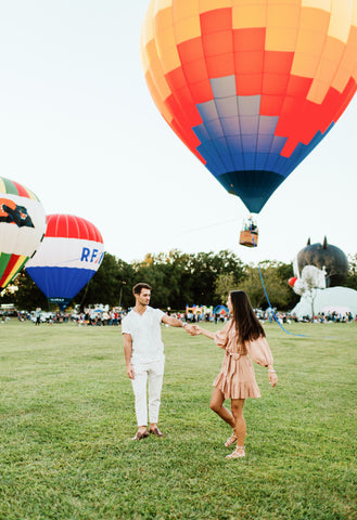 Photo of a Couple at a Hot Air Balloon Festival