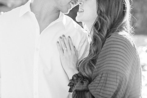 Photo of Engaged Couple Showing off Engagement Ring