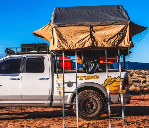 A truck with a tent on it.