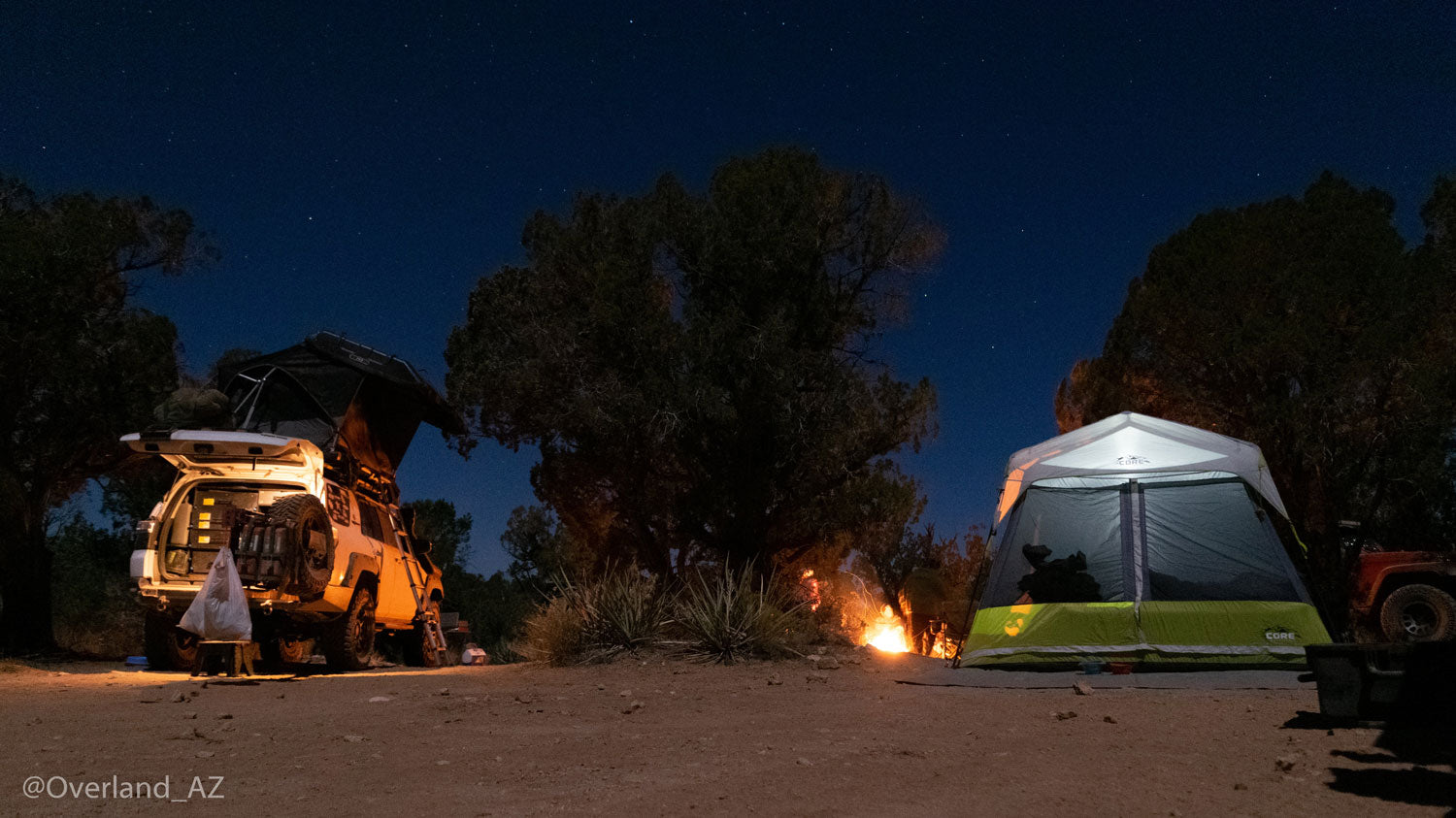 camping-storage-ideas-a-tent-and-a-vehicle-camping-at-night