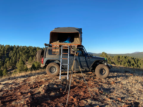 An overland vehicle with a rooftop tent.