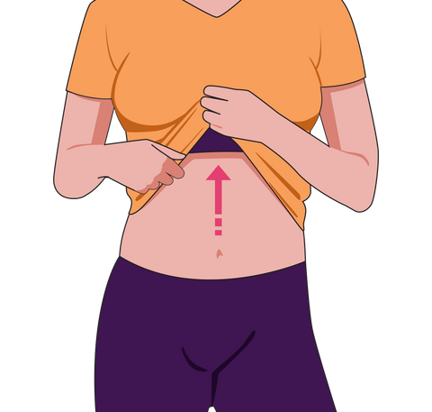 A woman cradling her stomach with her hands, possibly indicating readiness to start measuring her waist.