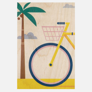 wooden postcard with palm tree and bike in miami