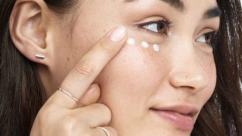 Woman applying Eye Cream