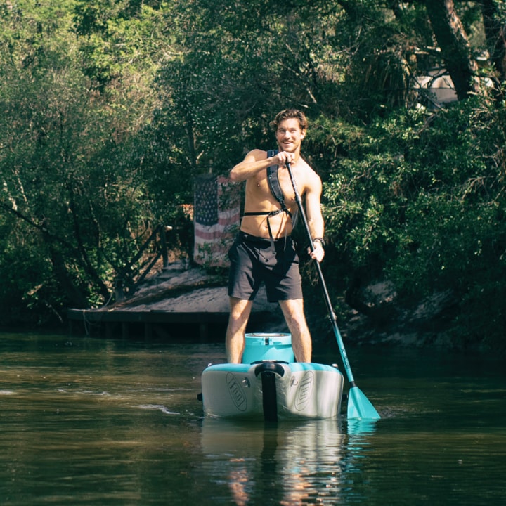 BOTEs inflatable kayaks, transform into a stand up paddle board in seconds. Man SUP paddling the DEUS Aero