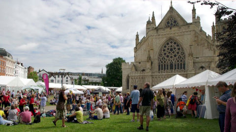 picture of the Cathedral Green with craft tents and lots of people