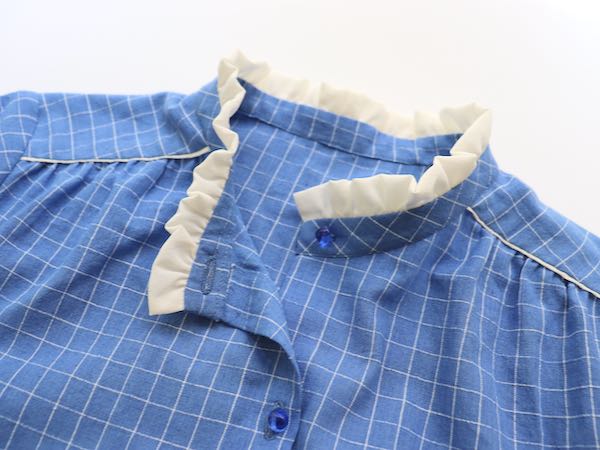 sew a blue shirt with white ruffled collar