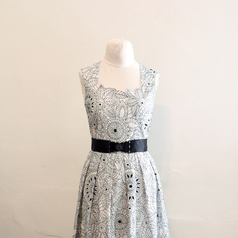 Embroidered dress with shaped neckline sewn by Loom and Stars