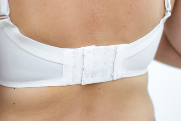Woman wearing bra with extender