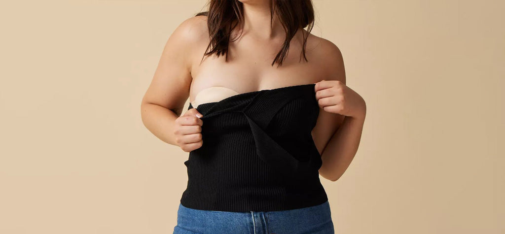 Woman showing off finelines strapless bra under top