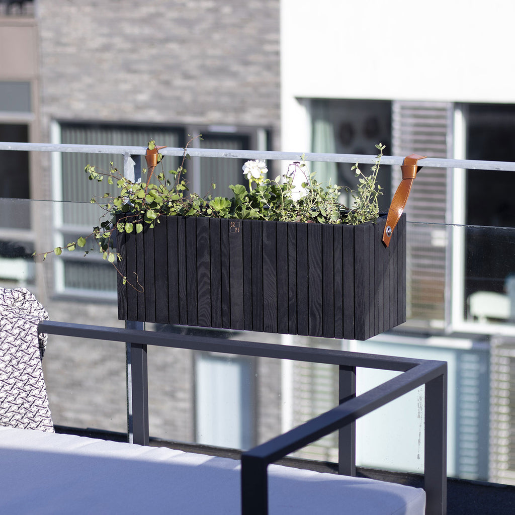Black wooden planter on balcony