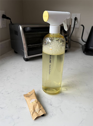 UGC of Blueland Multi-Surface Cleaner on Illuminate Labs Product Tester Hannah Westerman's kitchen countertop