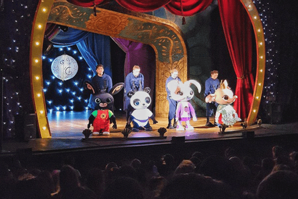 Bing actors and puppets on stage
