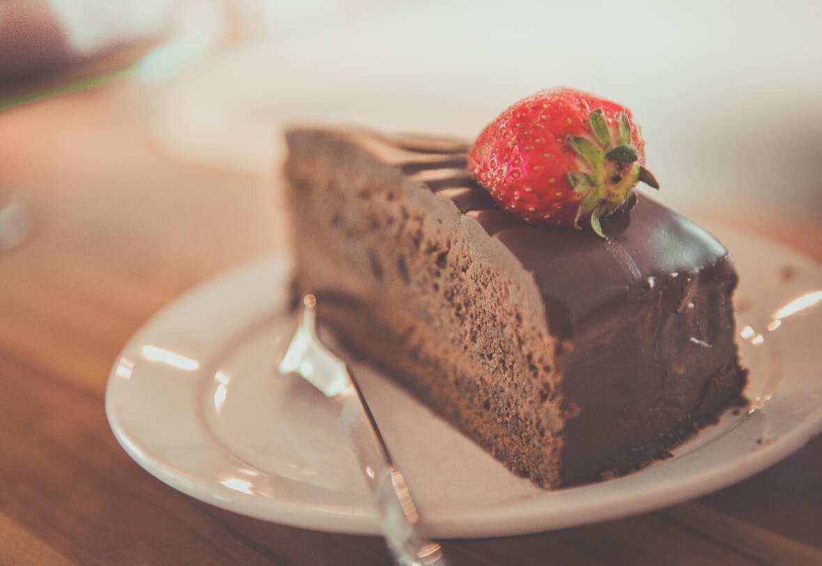 piece of chocolate cake with strawberry on top