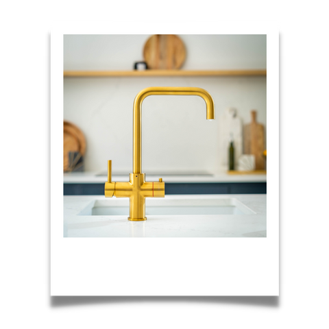 Gold instant hot water tap with stylish square neck spout.