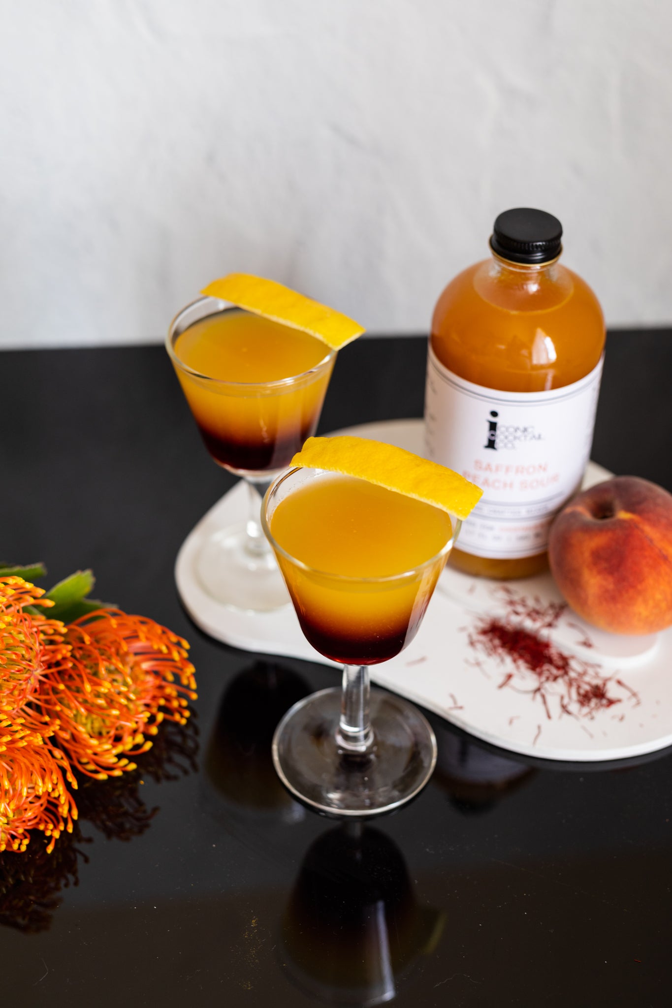 Pair a smokey blend scotch with sweet Saffron Peach Sour for a true classic. Find this summer flavor at Iconic Cocktail Co!