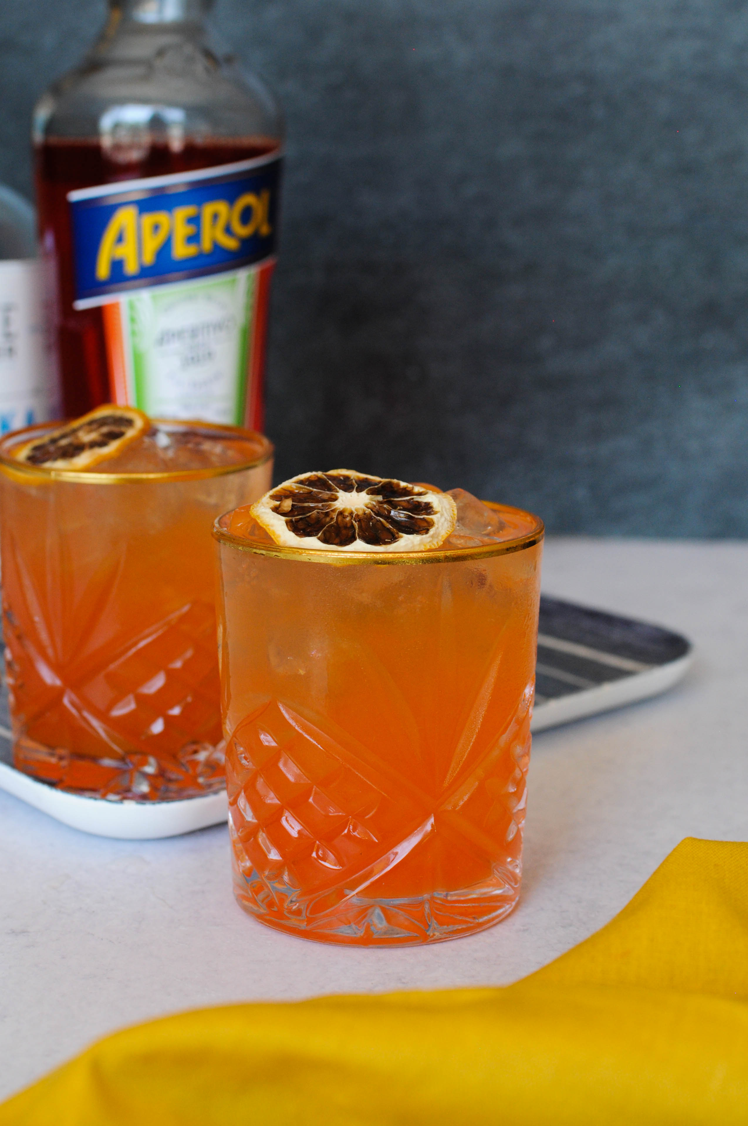 Try this Peach Aperol Cocktail made with Seasonal Special Saffron Peach Sour from Iconic Cocktail co.