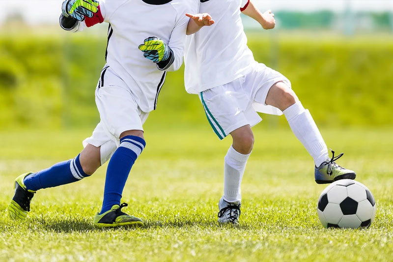 Athelete's feet - kids playing soccer - Purely Northwest