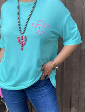 TURQUOISE T SHIRT WITH HOT PINK COWBOY SMILEY