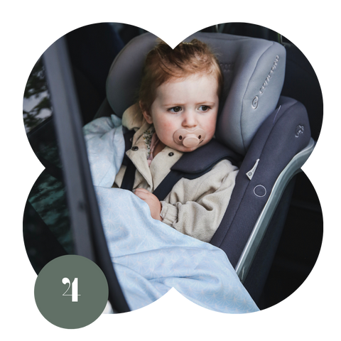 Toddler girl in a car seat