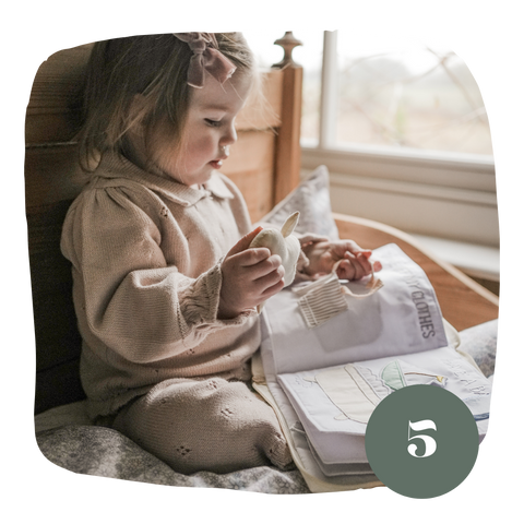 Child reading in bed