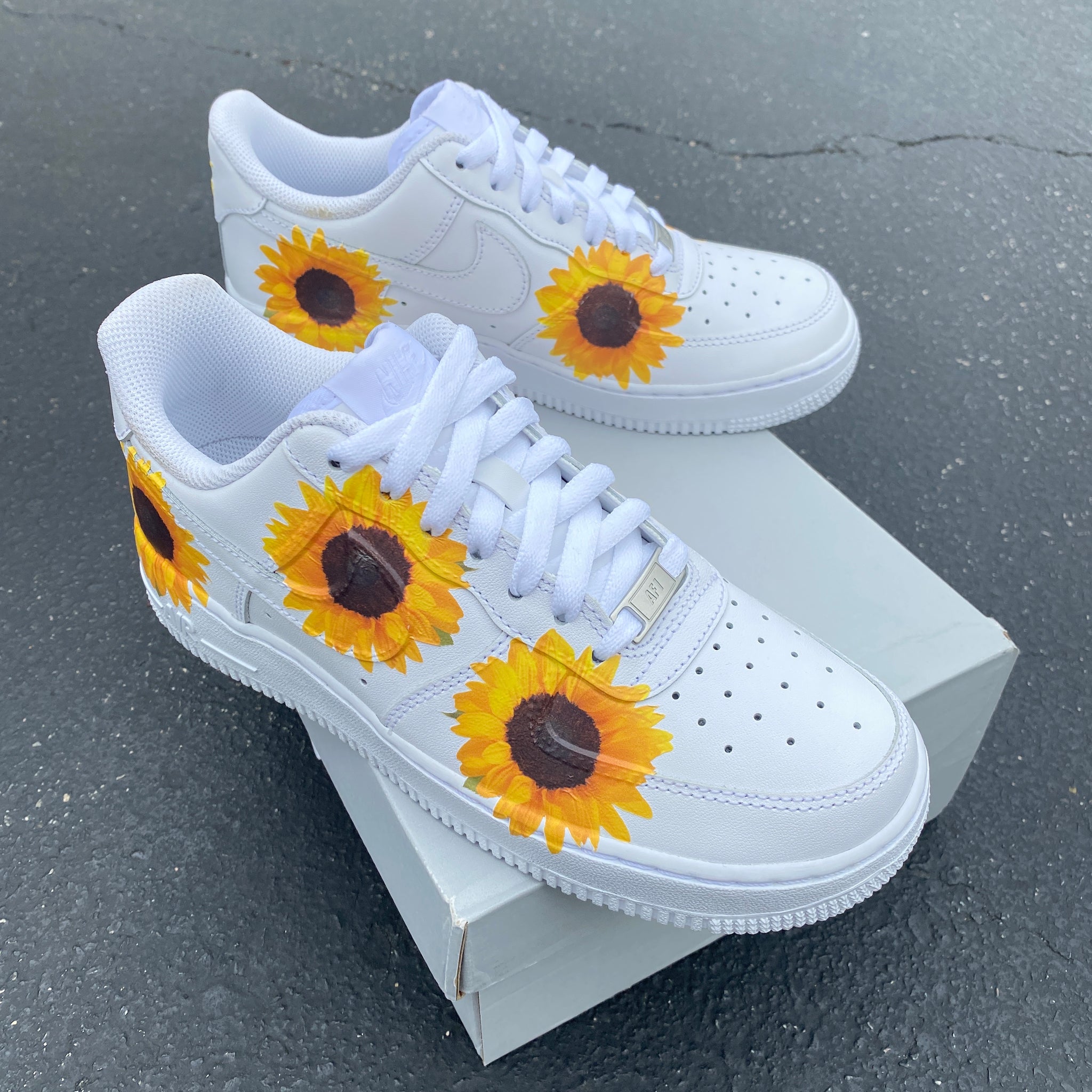 white sunflower nike slides
