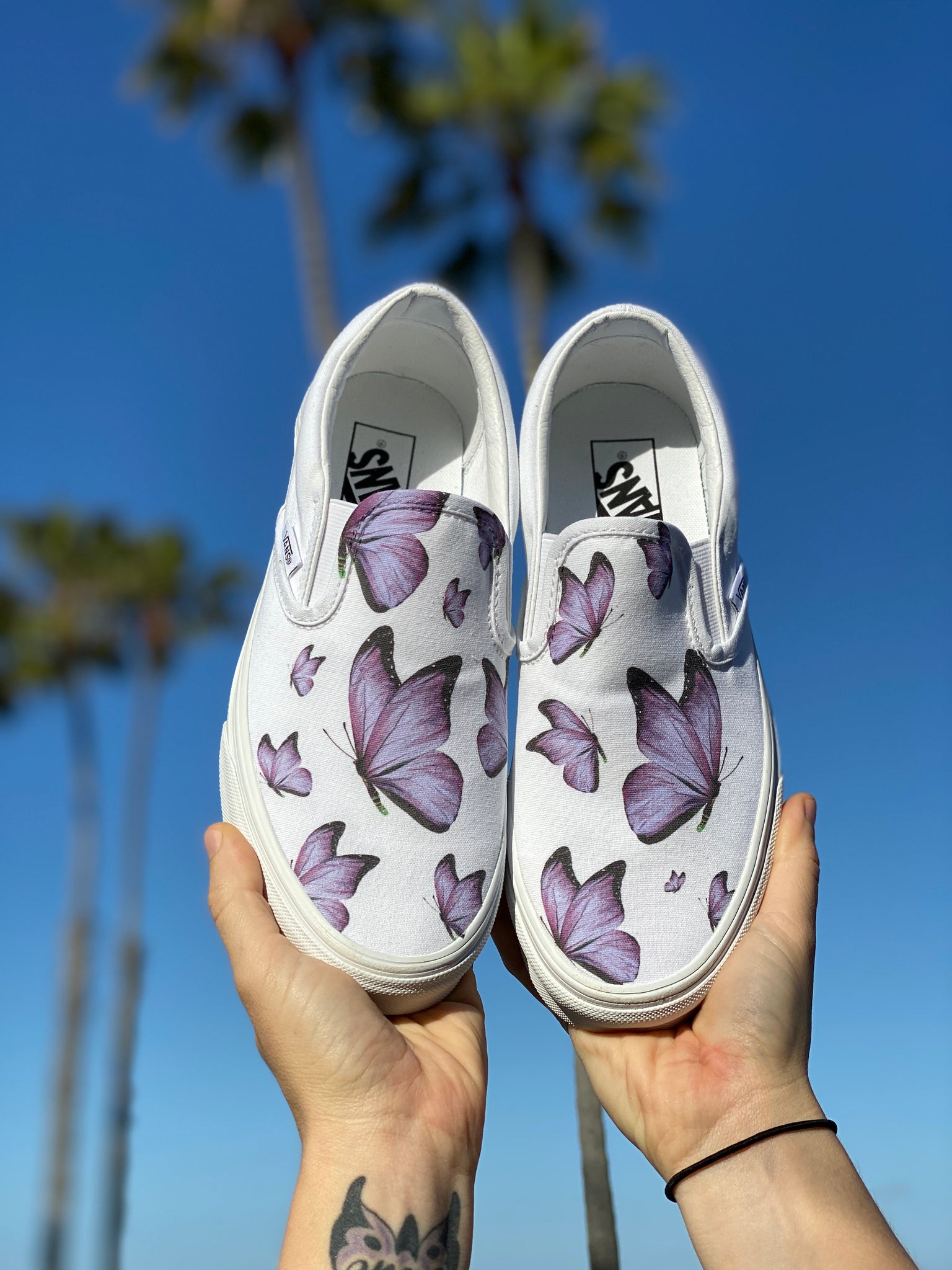 white vans with butterflies