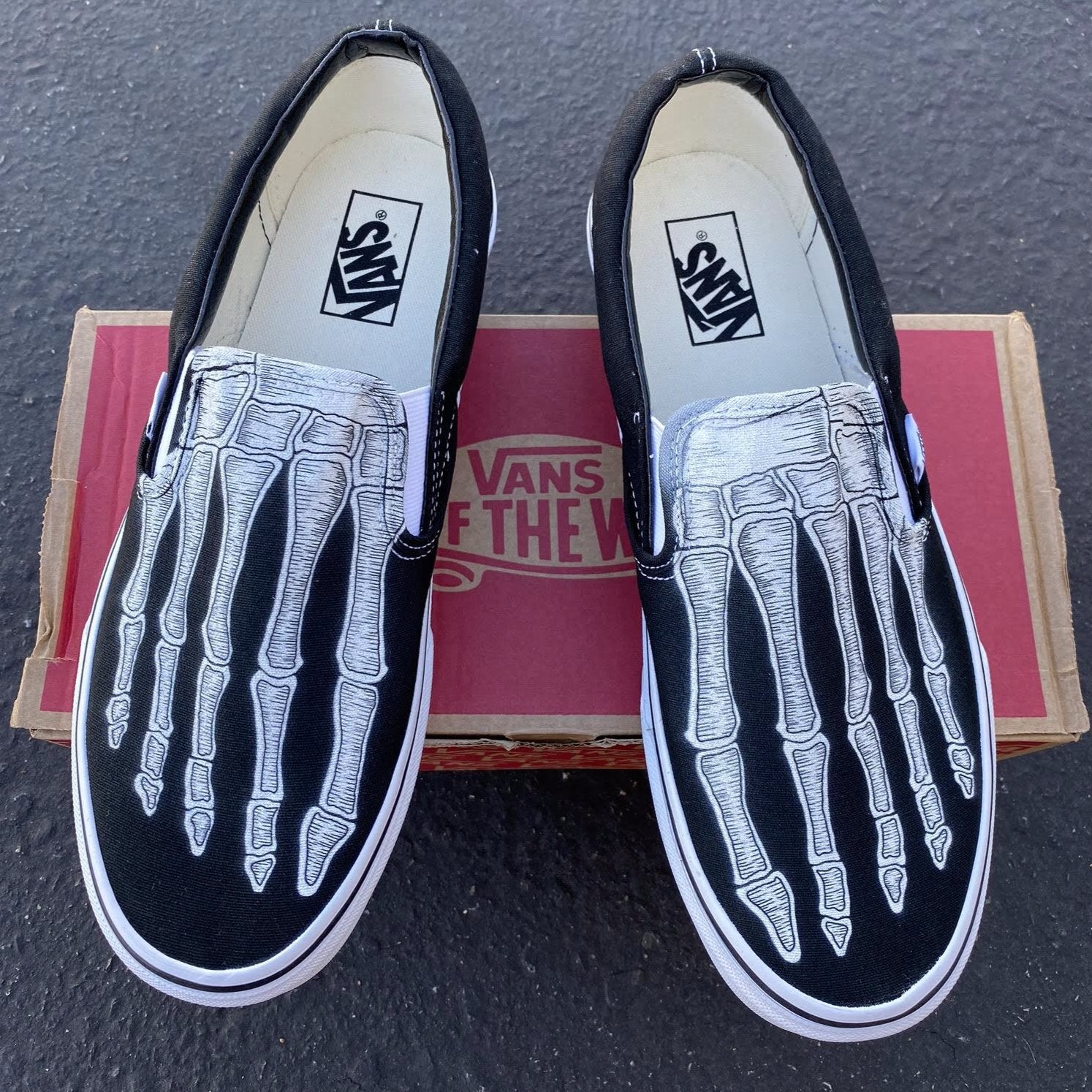 skeleton slip on vans