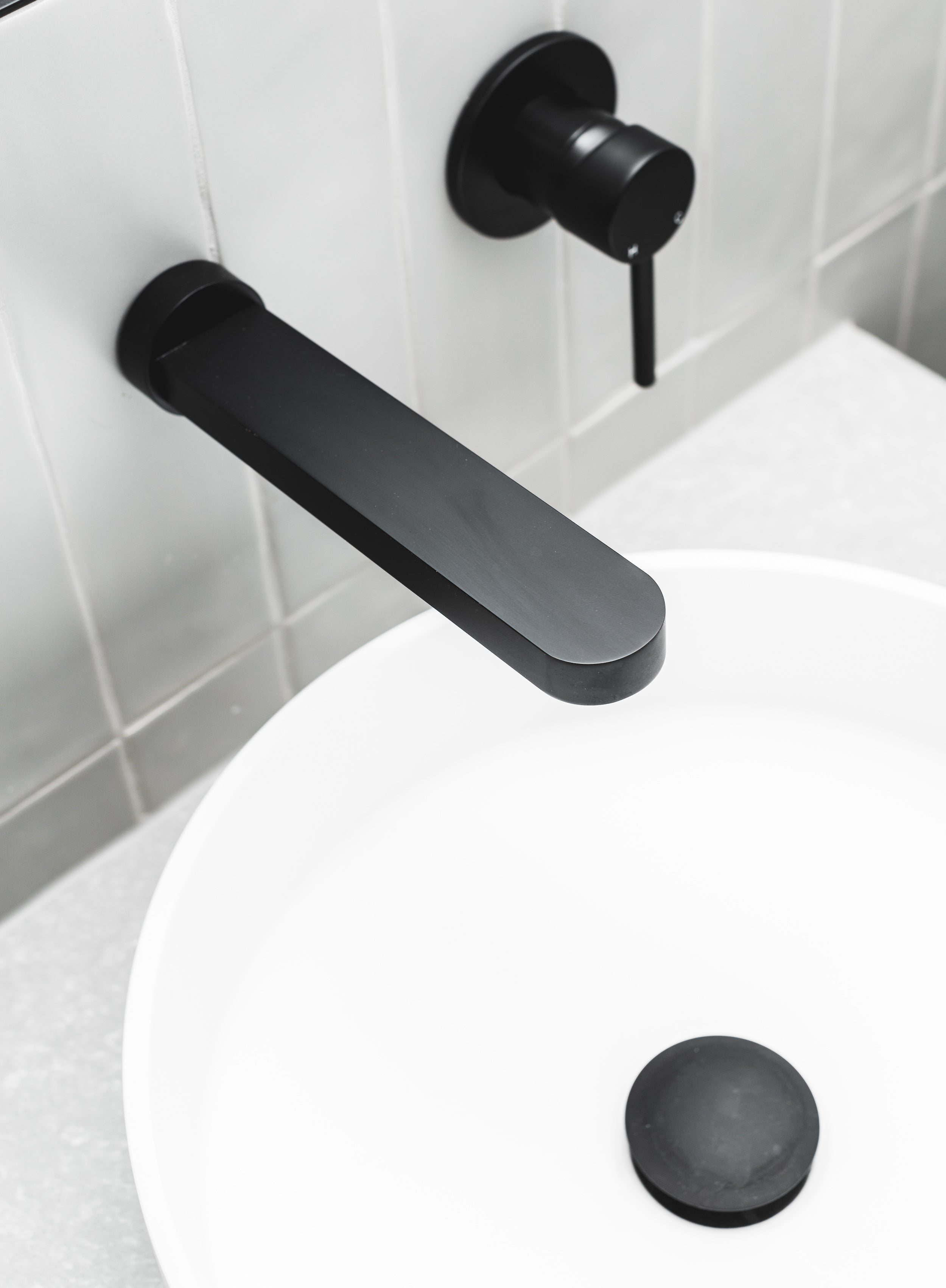 Bathroom basin with Meir black taps and pop up waste