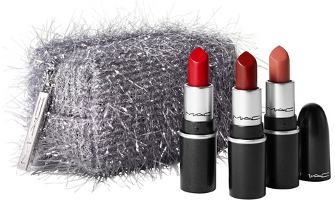 Lithe Lashes Blogs Holiday Gift Ideas Fireworked Like A Charm Mini Lipstick Kit, showcasing a silver confetti style looking rectangular box with three red lipsticks showing MAC logo on all three
