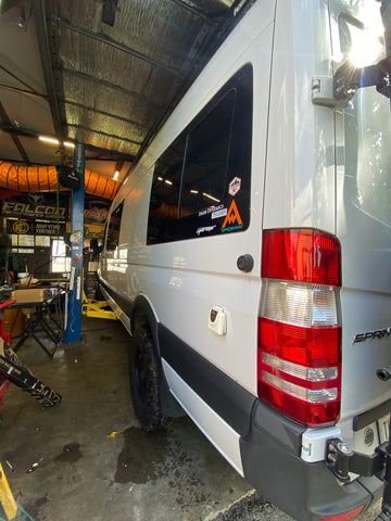 Mercedes Sprinter van sits on the lift at the old shop