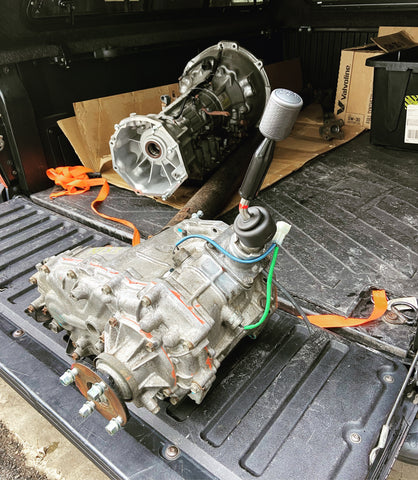 FJ Cruiser transfer case sits in the bed of a 2nd gen Toyota Tacoma