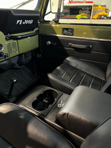 Detailed view of the interior of the Jeep Scrambler including seats, new door panels, and center console.