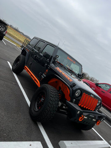 Powdercoat matched rock sliders and grill inserts shown on Jeep Wrangler